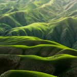 bird's eye view photograph of green mountains